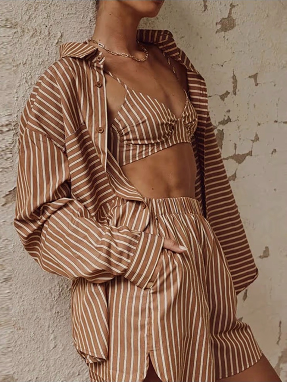 Women’s 3 pieces casual long sleeve bra and loose longer short set.